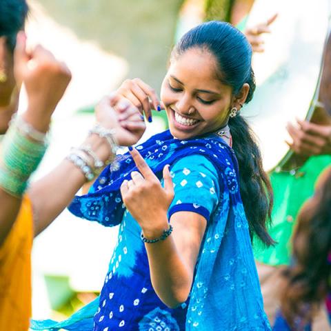 A young person belly dancing.