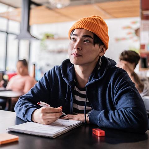 A young person learning in a classroom 