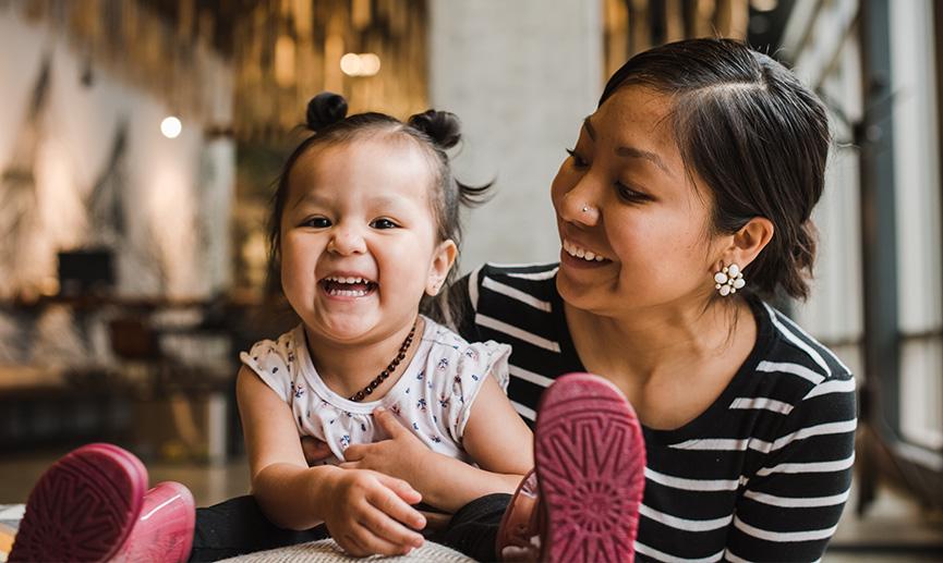 Indigenous mother and child smiling