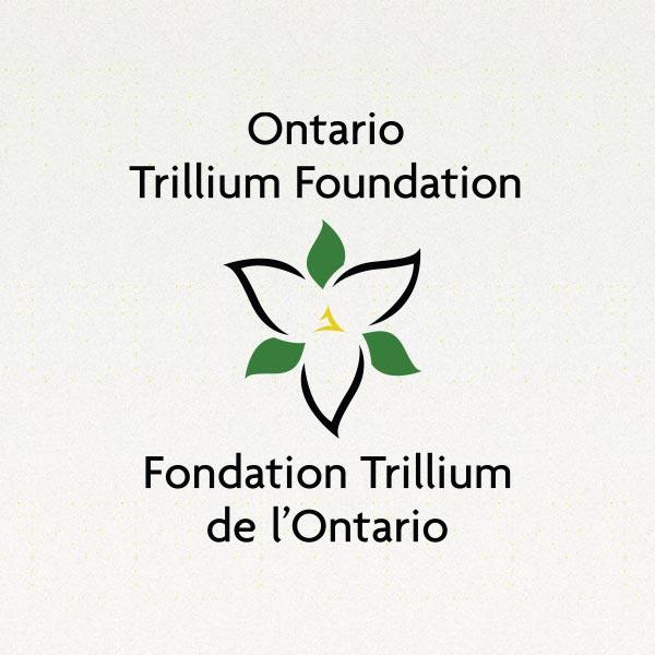 The current Ontario Trillium Foundation logo shows the Trillium flower in a minimalist design with green leaves intersecting the three petals.   The words Ontario Trillium Foundation are above the logo and the words Fondation Trillium de l’Ontario are below the logo.