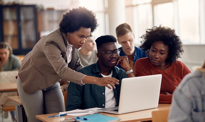 College students e-learning with their teacher during a class. 