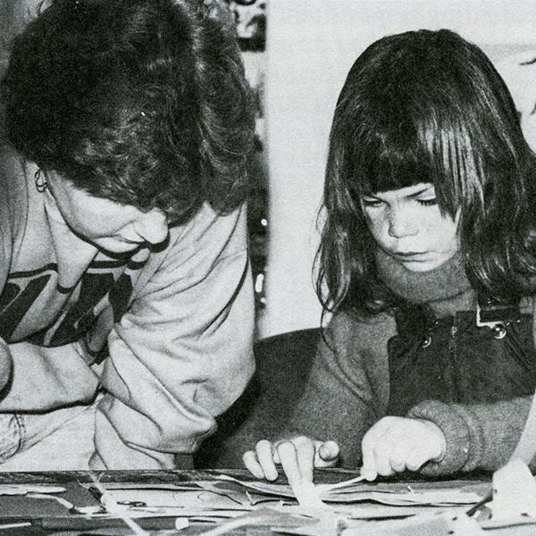 A Big Sister and Little Sister participate in a crafting program. 